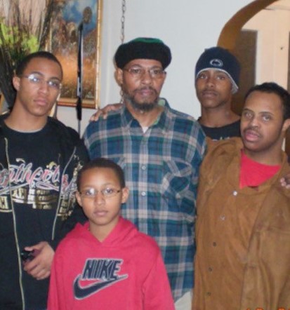 Hakim’s father (center) is surrounded by Hakim’s sons.