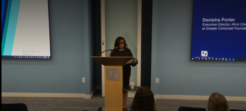 Denisha Porter standing at lectern