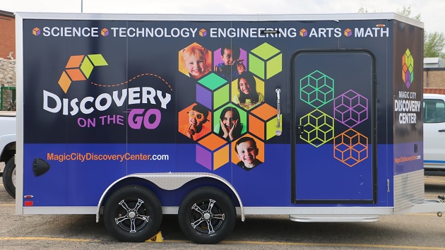 Truck with words "Discovery on the Go, Science, Technology, Engineering, Arts, Math"