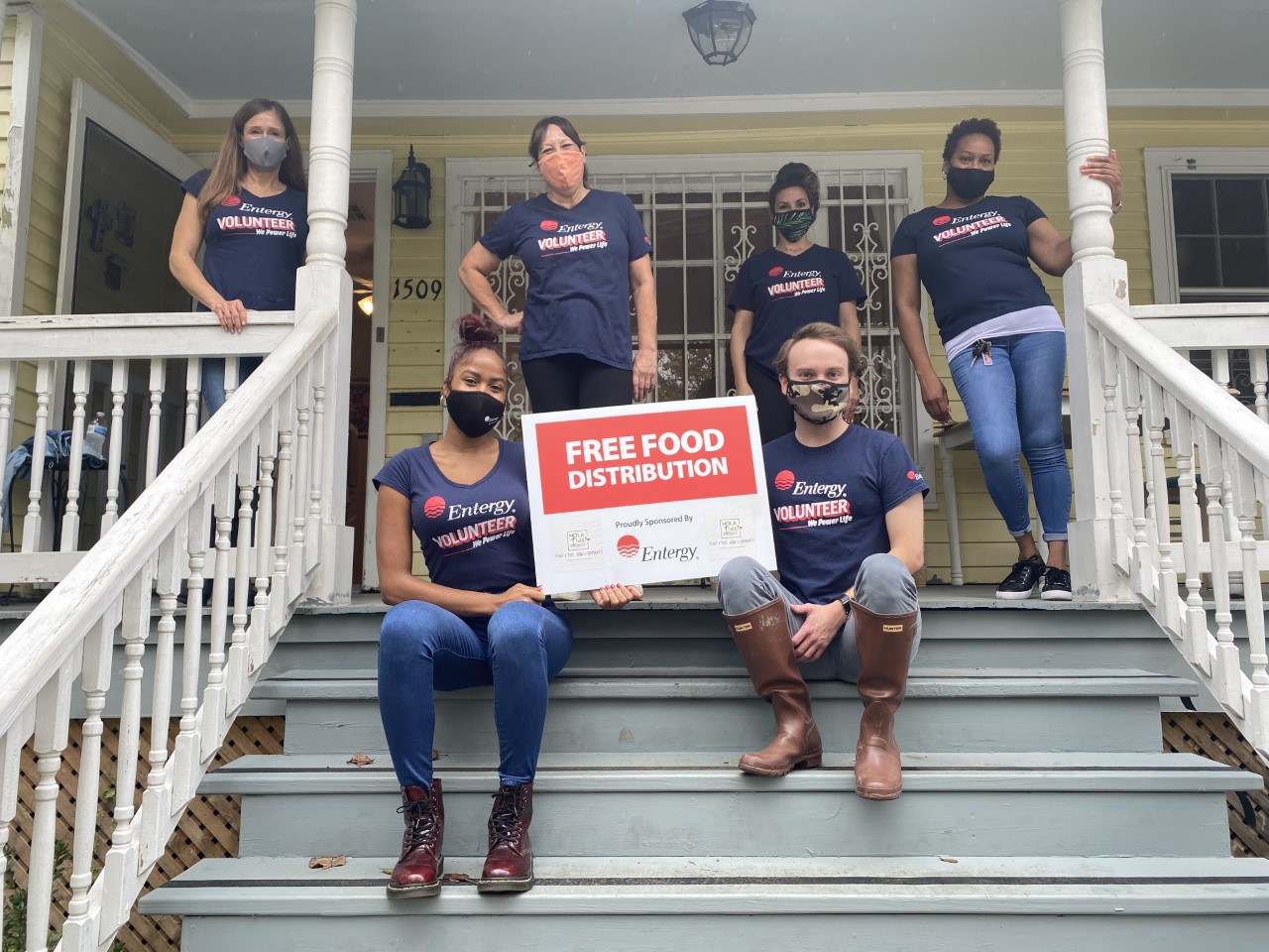 volunteers posing on steps