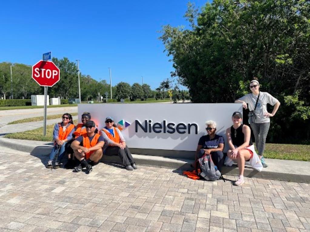 Nielsen Team Members in front of the corporate headquarters.
