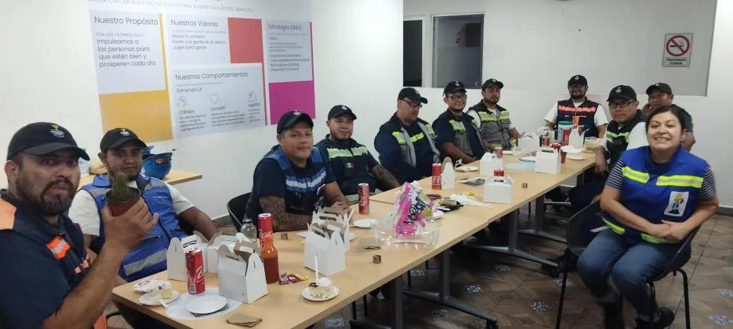 People seated at a long dining table.