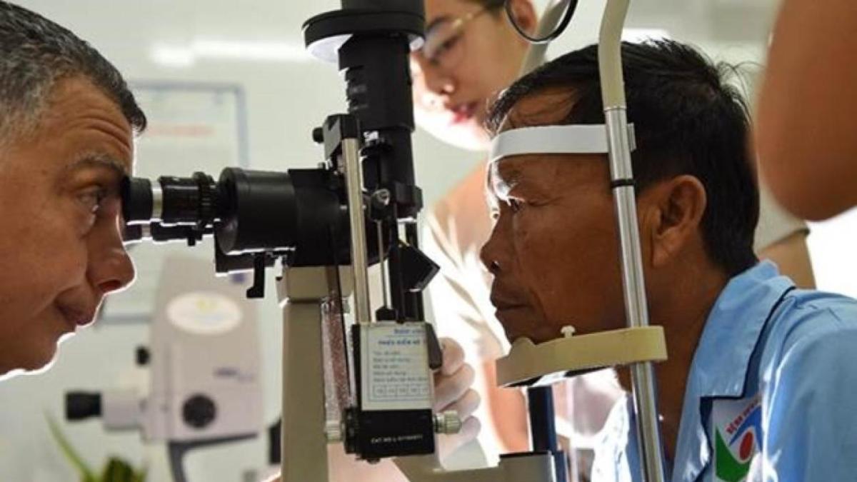 Doctor examining patient's eyes