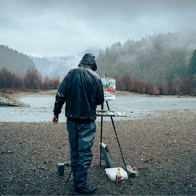 person painting the landscape