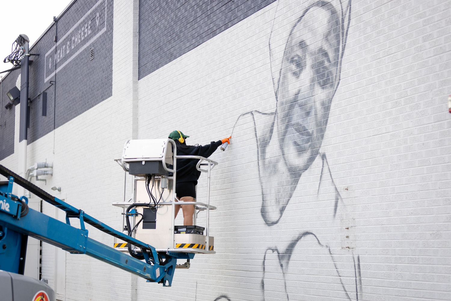 Local artist Chelsea Lewinski begins work on the Denver mural — Fairtrade farmers