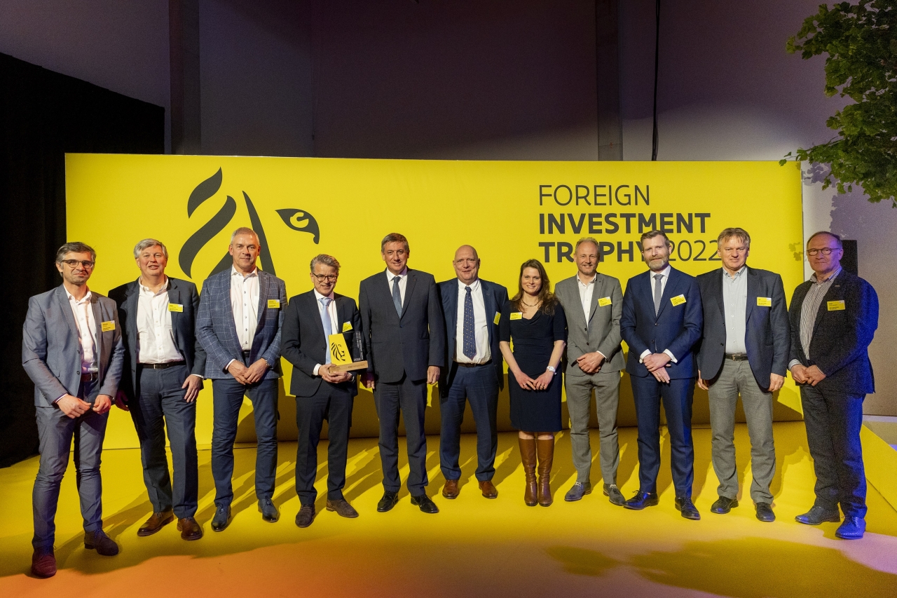 Group of people on stage accepting an award