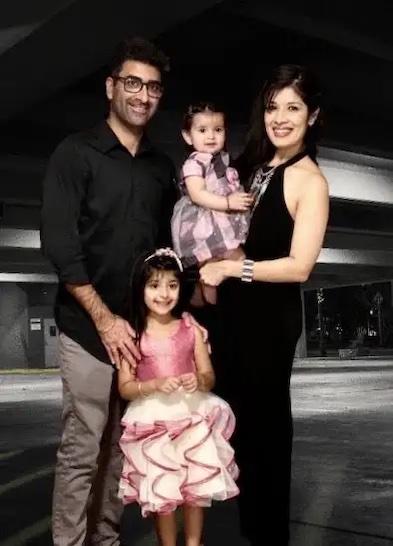 Richa Gandhi with her husband and two daughters.