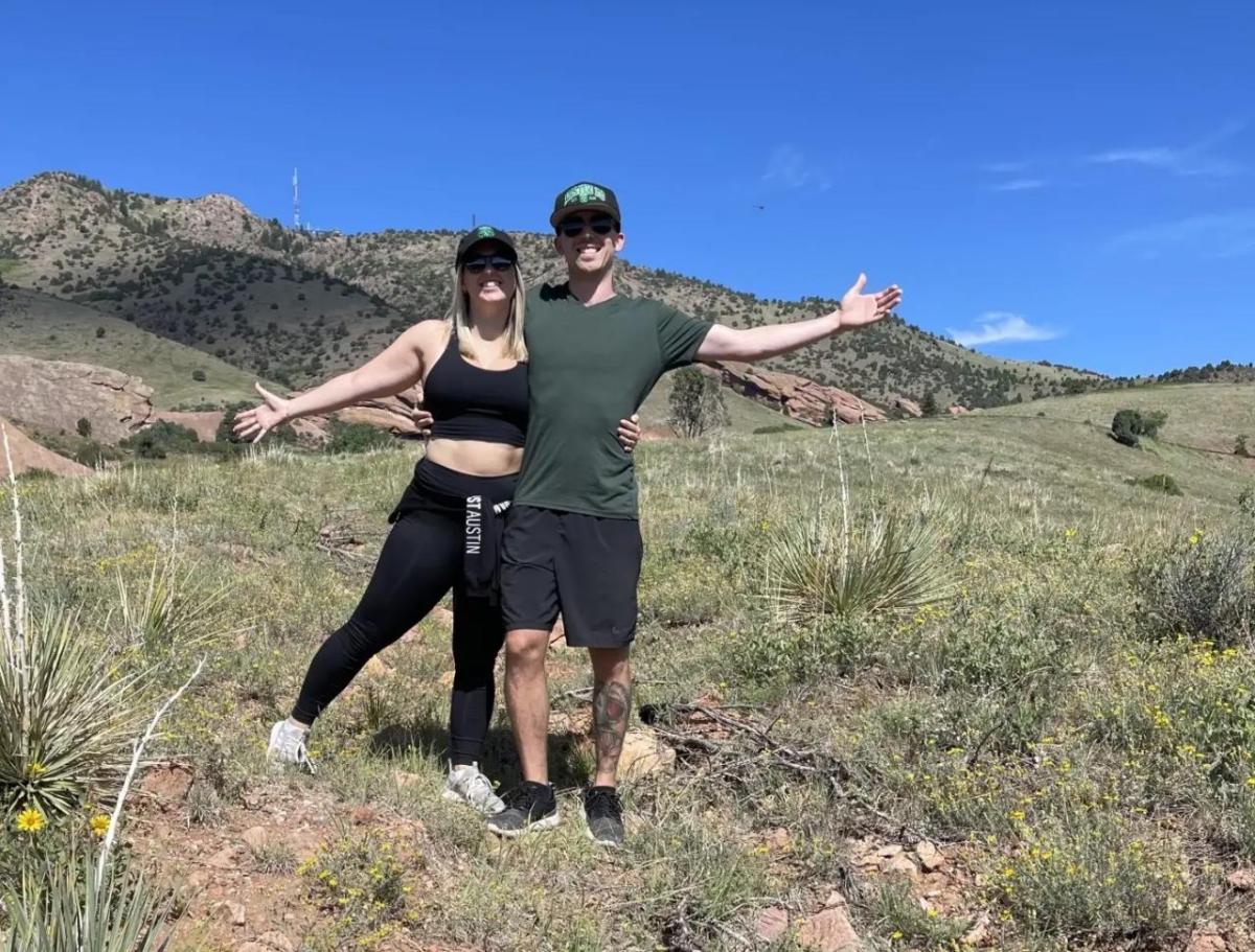 Erik and his wife shown on a hike.
