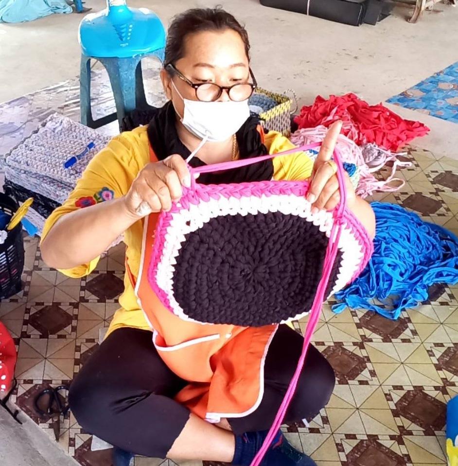 Thai woman knitting.