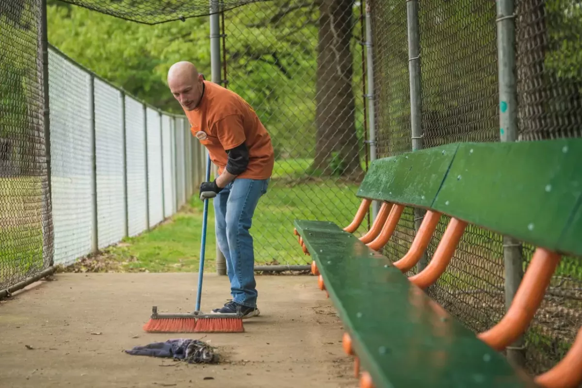 A volunteer cleaning up trash