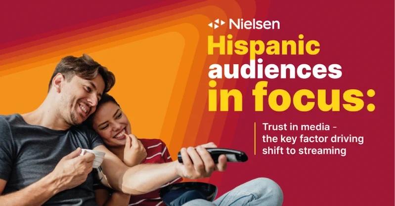 Nielsen Hispanic audiences in focus. Trust in media. Couple shown with a remote control.