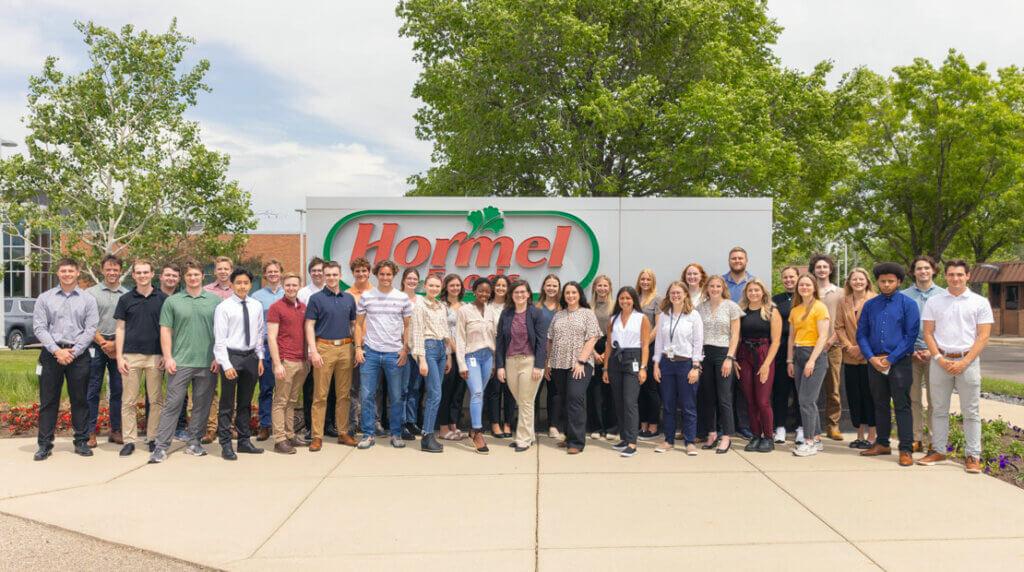 Hormel Interns in front of sign