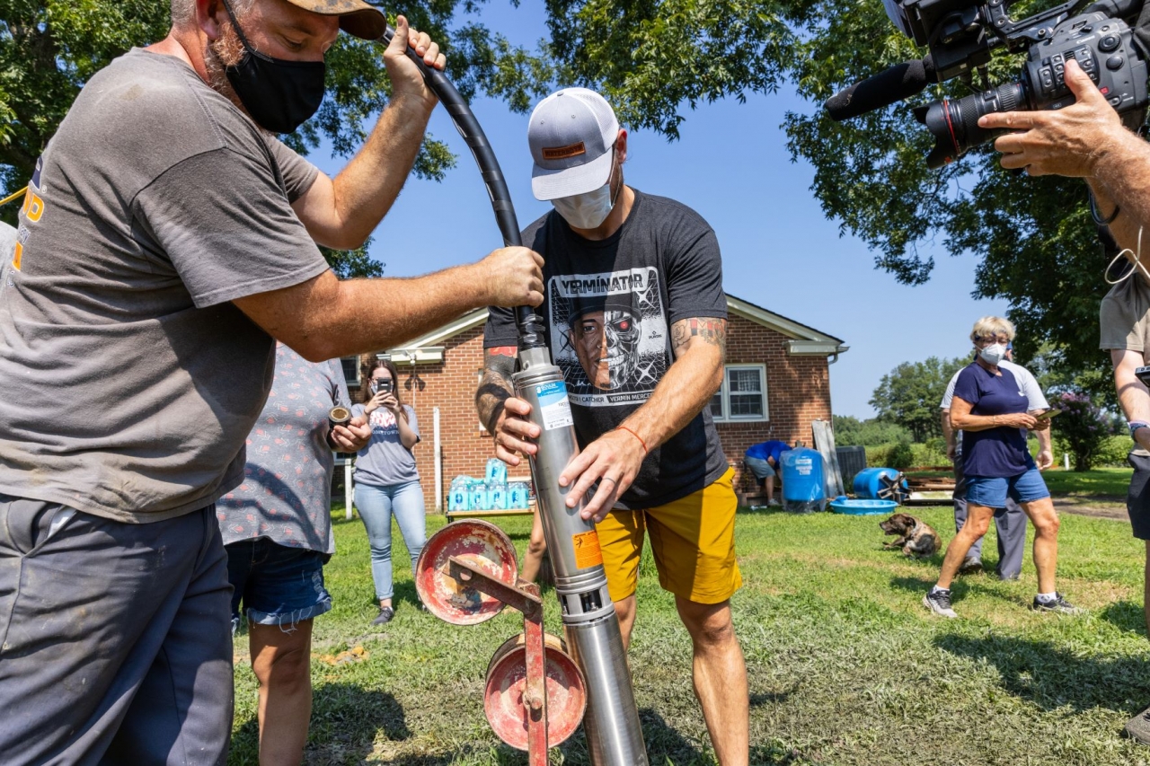 people installing a well