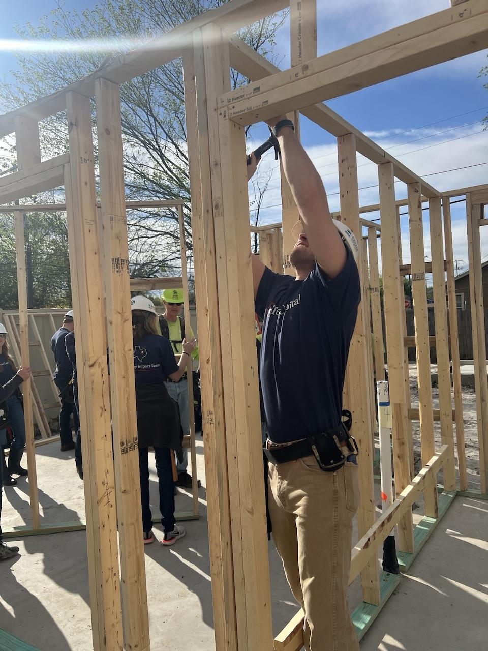 volunteers build the house