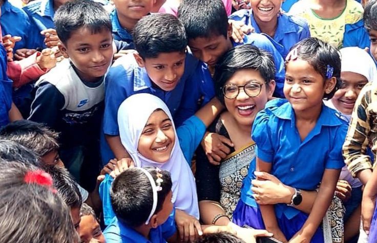 Young students in Bangladesh shown with their teacher.