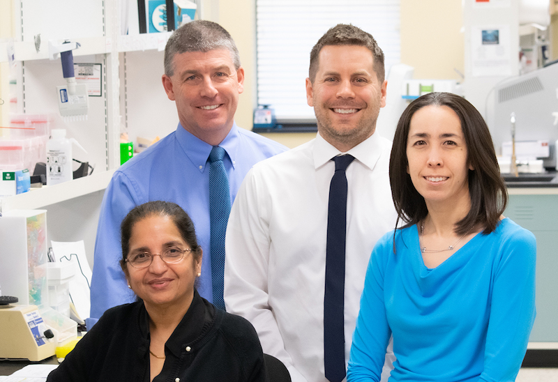 Dr. Mike Friez (second from left) directs Greenwood’s diagnostic laboratories. From left to right, he is joined by Associate Director Fatima Abidi, PhD; Associate Director Raymond Caylor, PhD; and Lead Director Jennifer A. Lee, PhD, all of Greenwood’s Molecular Diagnostic Laboratory.