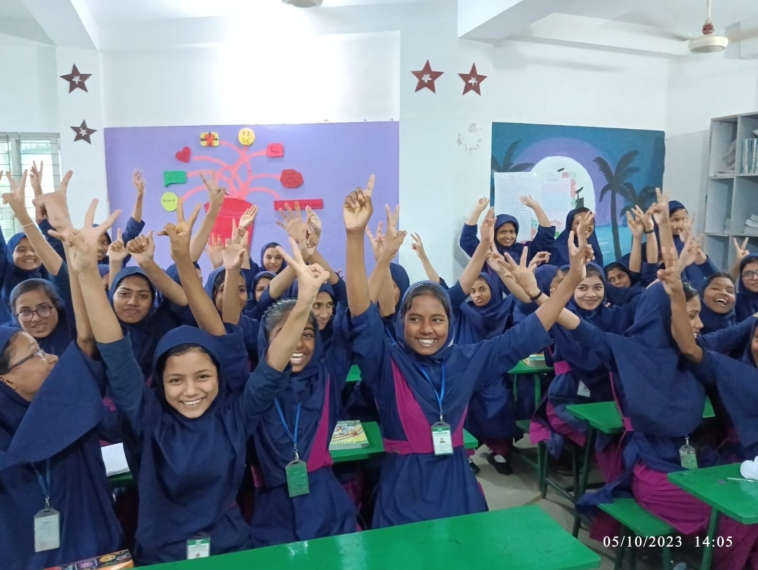 A group of students in a Commit2Change classroom in Bangladesh — International Day of the Girl