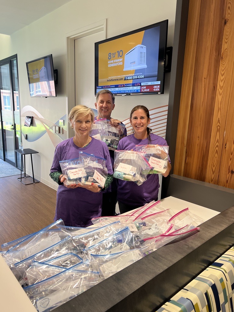 group of volunteers making toiletry kits