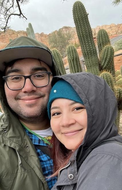 Jacob Rodriguez and his wife in front of a cactus.