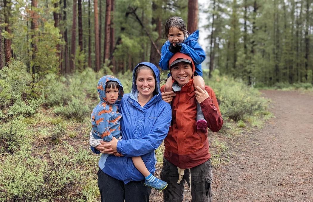 Jenny Luong shown with her husband and children hiking.