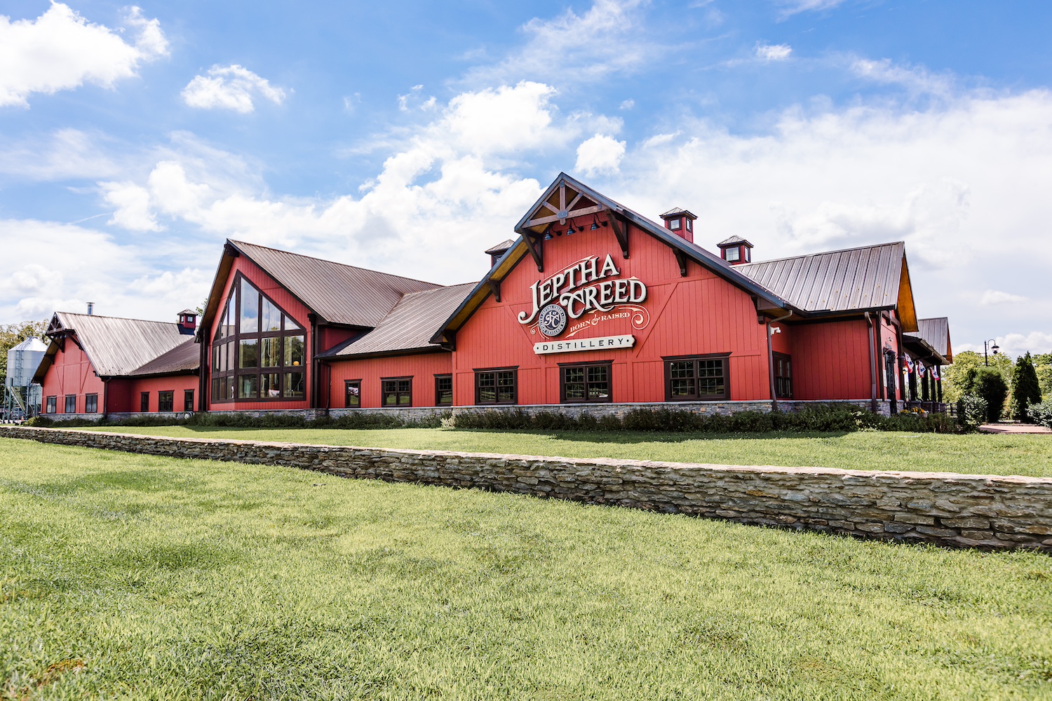 The red Jeptha Creed distillery building. 