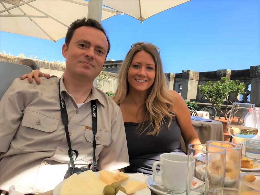 Joe Styler and his wife having breakfast on the deck of a building.