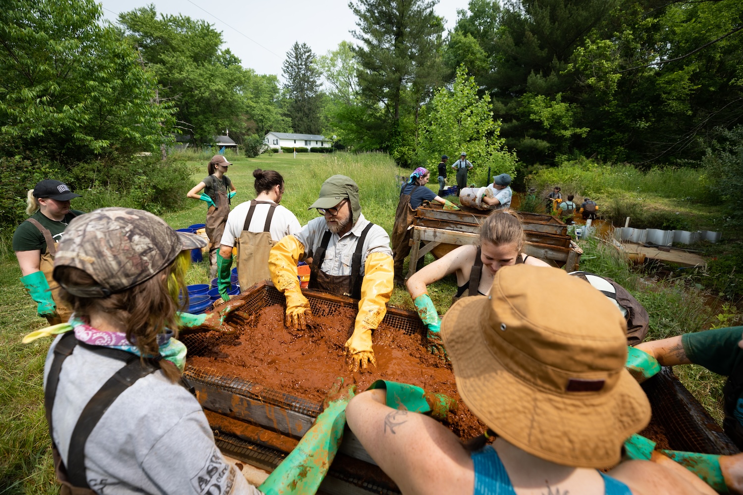 John Sabraw of Ohio University works with students to remove pigment from polluted water.