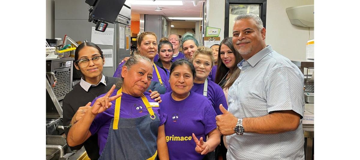 Juan Marquez and McDonalds team in a restaurant.