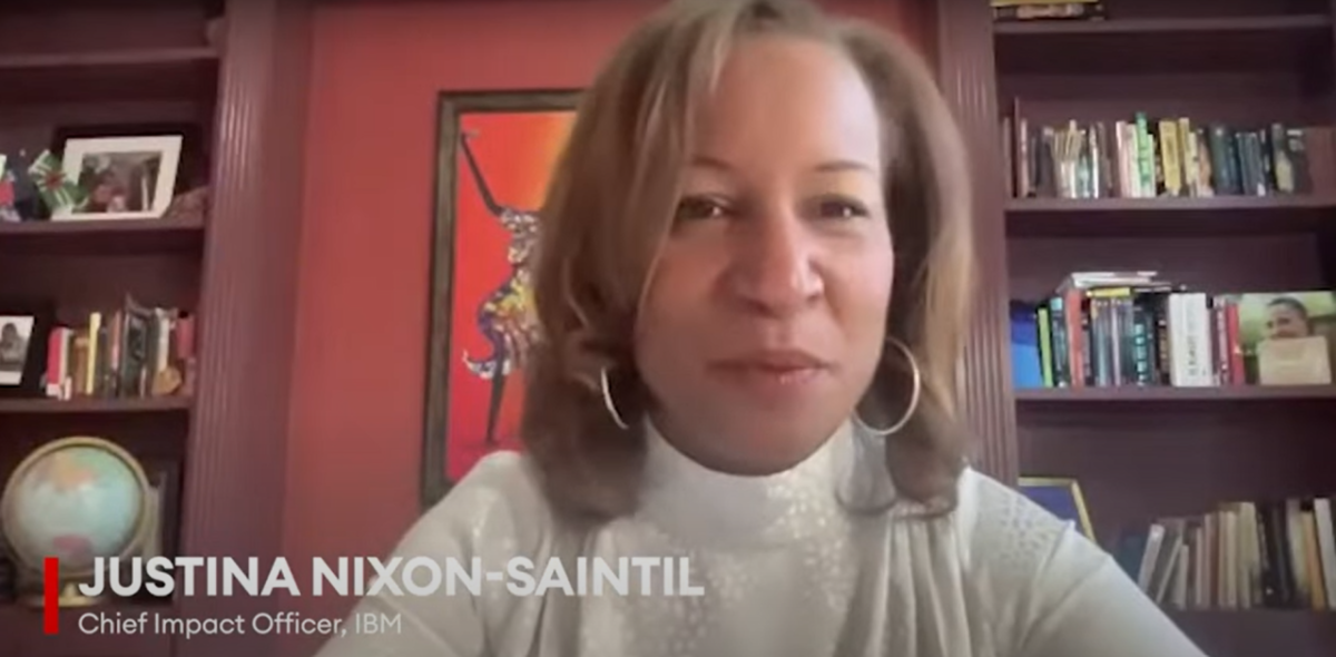Justina Nixon-Saintil sitting in a home office setting