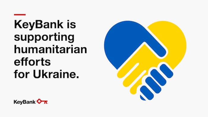KeyBank is supporting humanitarian efforts for Ukraine. Hands shaking in blue and gold.