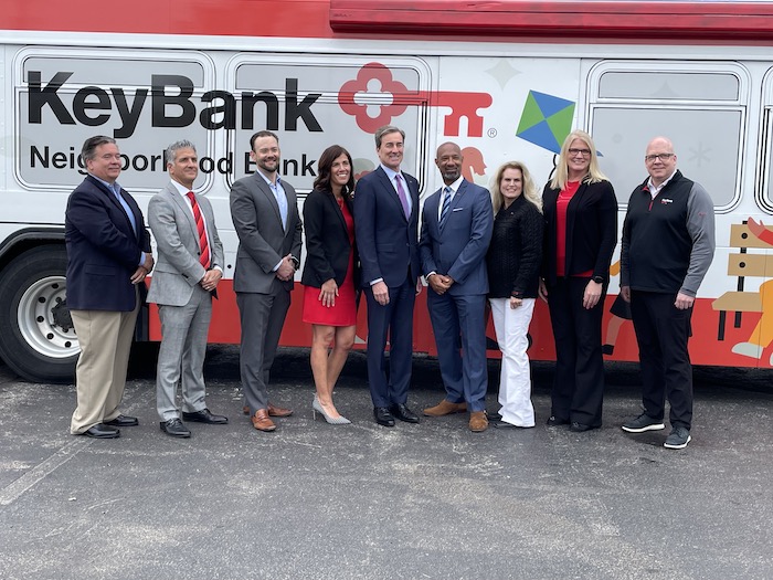 People standing in front of the keybank bus