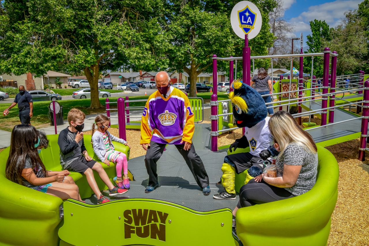 LA Kids and Adults playing on a playground