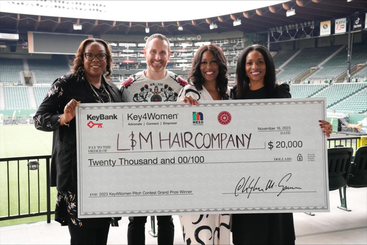 Key4Women Pitch Contest winners shown with a $20,000 check.