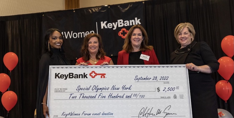 Key4Women presented with a check at Key4Women forum in albany.