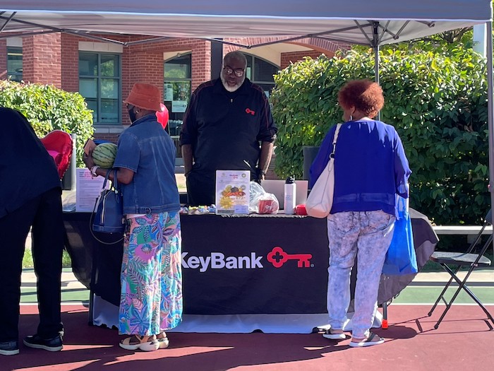 KeyBank volunteer table at the Farmers Market.