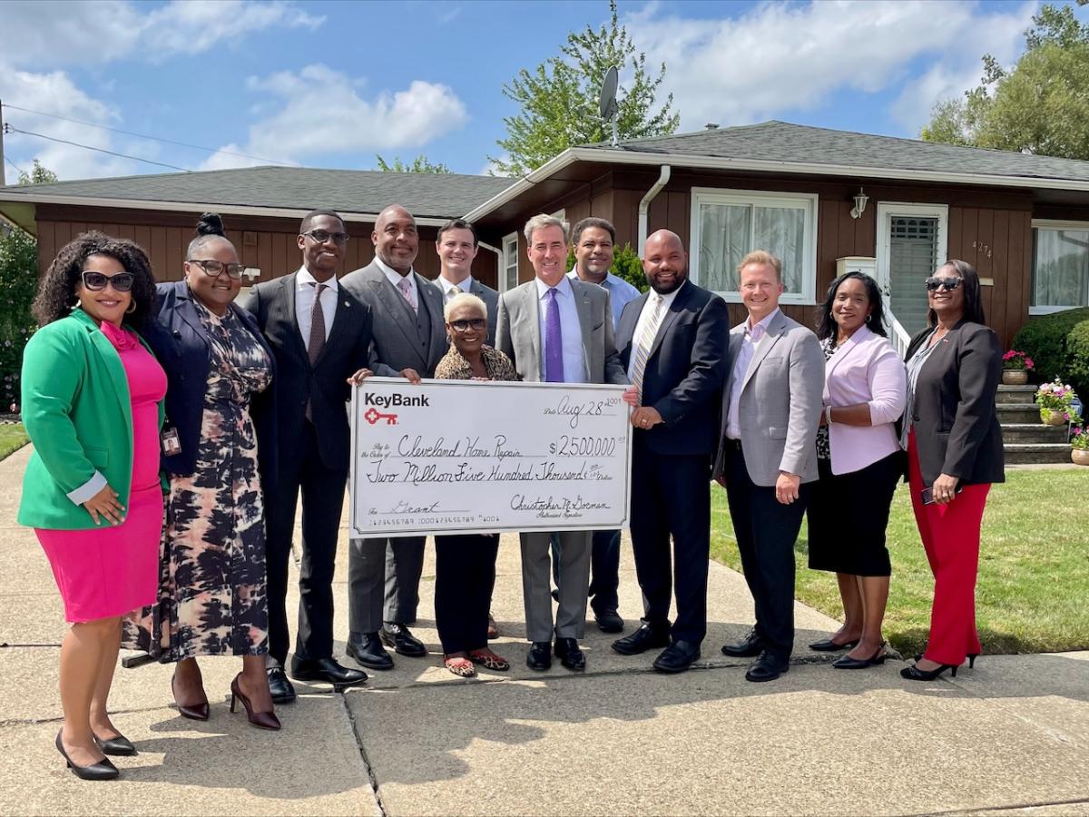 Representatives from Cleveland Home Repair accept a grant check from KeyBank for $2,500,000.