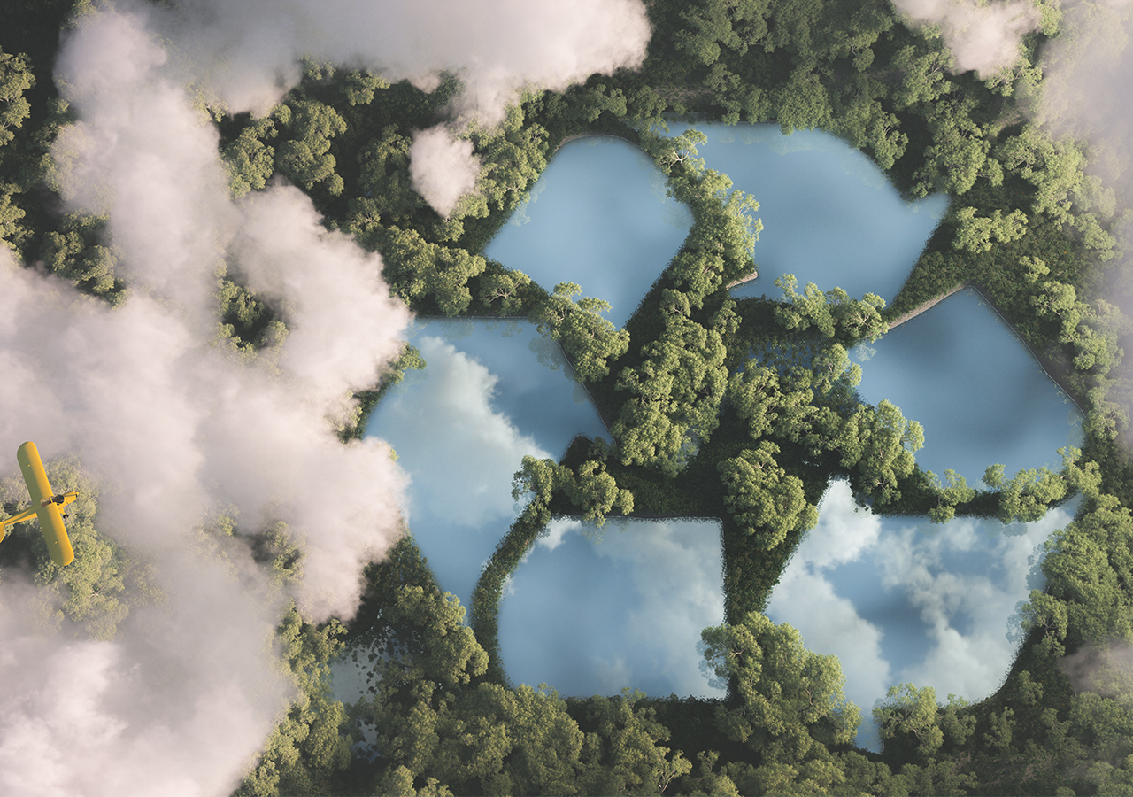 recycling logo embedded in a forest canopy, birds eye view