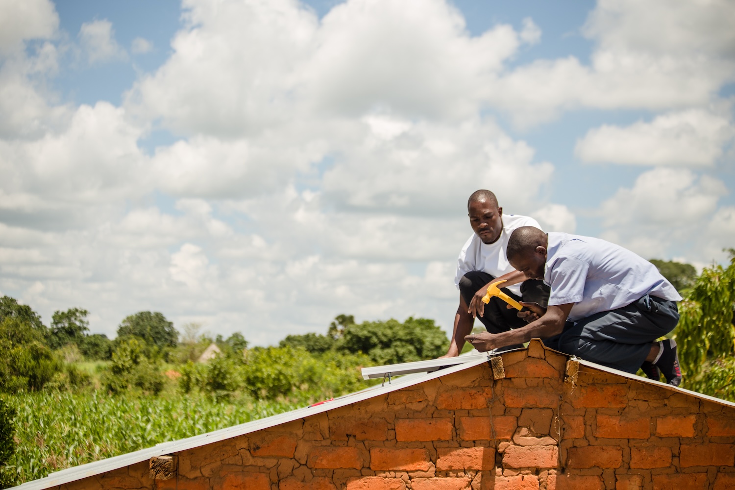 Little Sun - Zambia_Sales agents installing a solar home system_credit Chona Mwemba — offgrid solar in rural africa