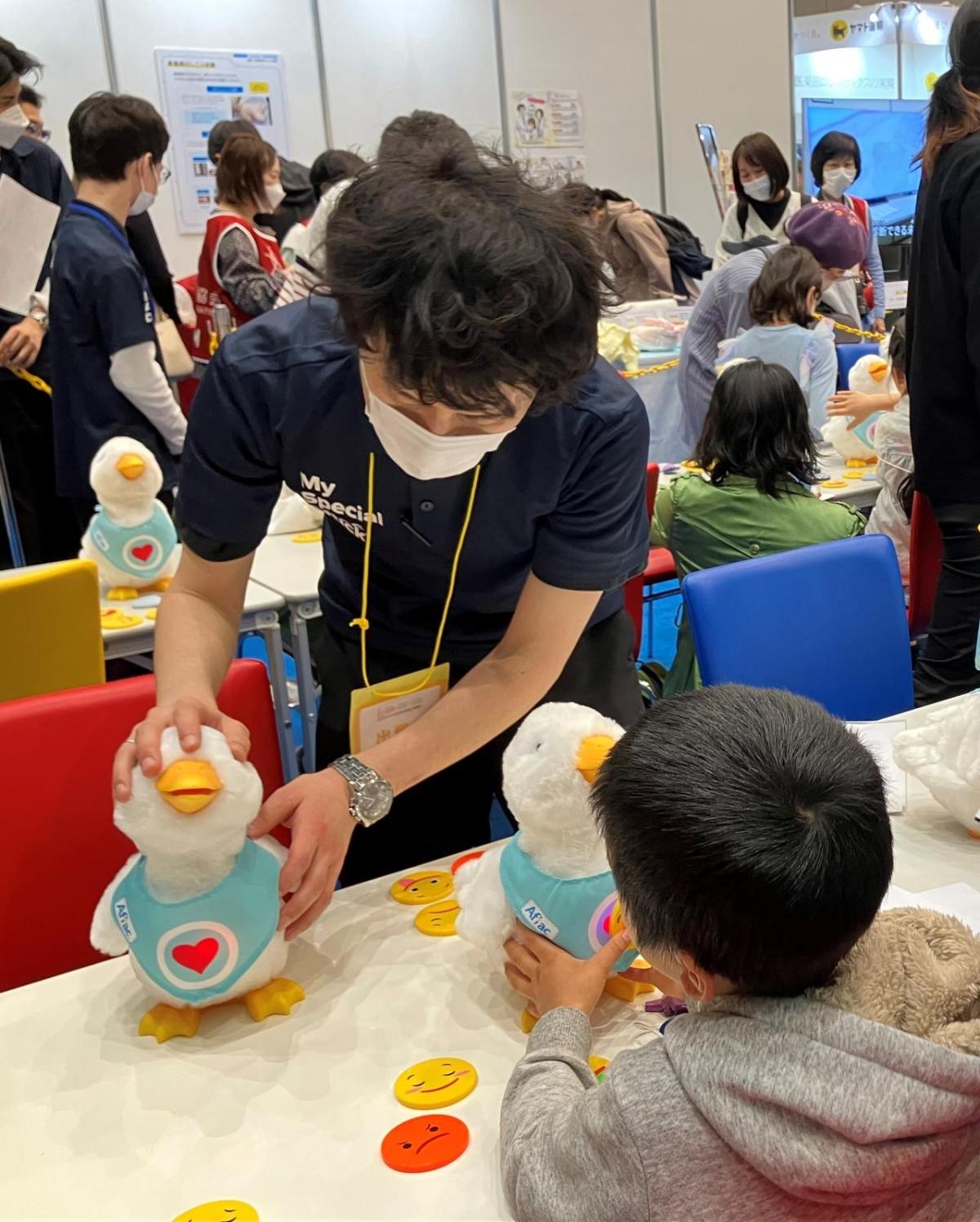 At the General Meeting of the Japan Medical Association, kids interact and play with social robot My Special Aflac Duck, which provides comfort and joy to kids with cancer and sickle cell disease.
