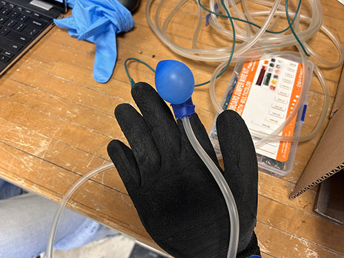 Glove with balloon