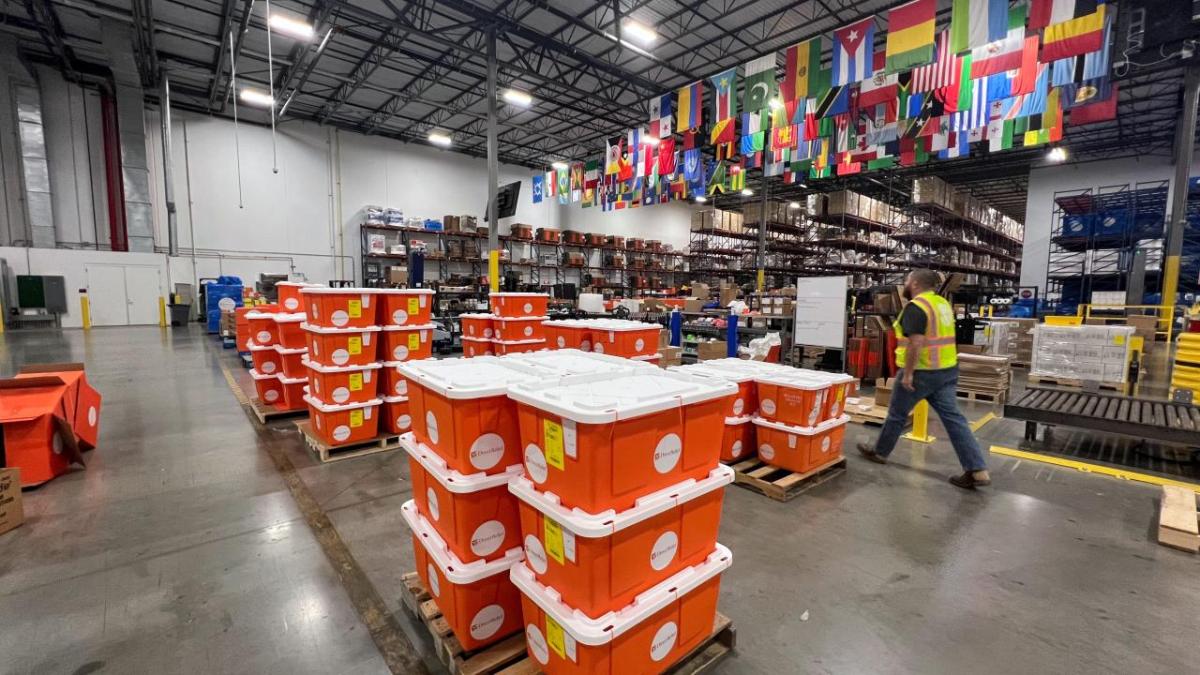 orange tubs of medicine in a warehouse