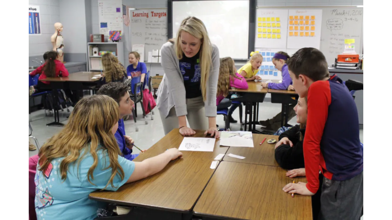 Megan Terry and a classroom of children