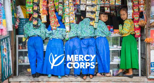 group of children with the Mercy Corps logo superimposed