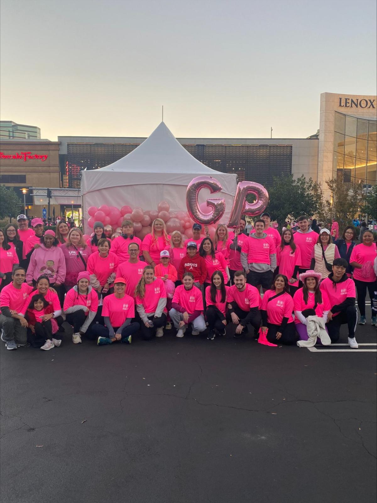 A large group of Georgia-Pacific employees wearing pink
