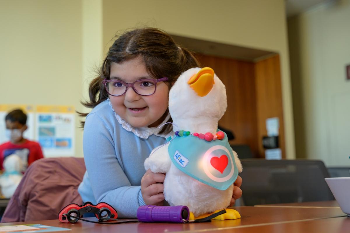 My Special Aflac Duck shown with a young Girl at Lurie Children's Hospital.