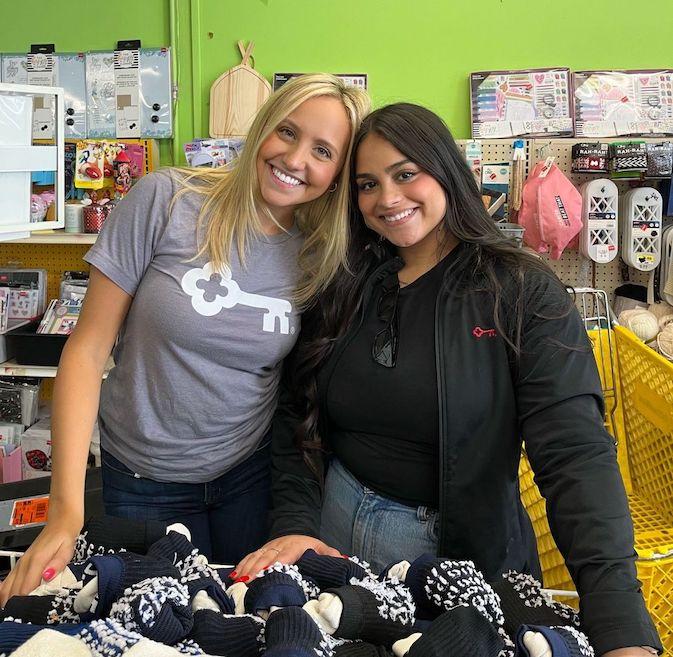 KeyBank volunteers gathering shoes and clothes for kids.