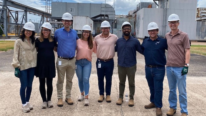 NRG Interns shown on a worksite wearing hardhats.