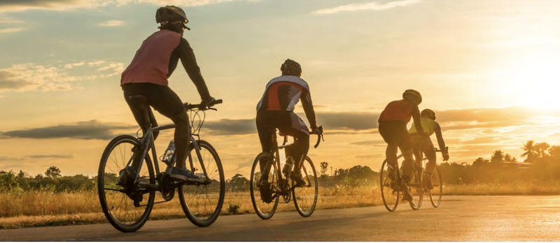 3 bicyclists in at dusk