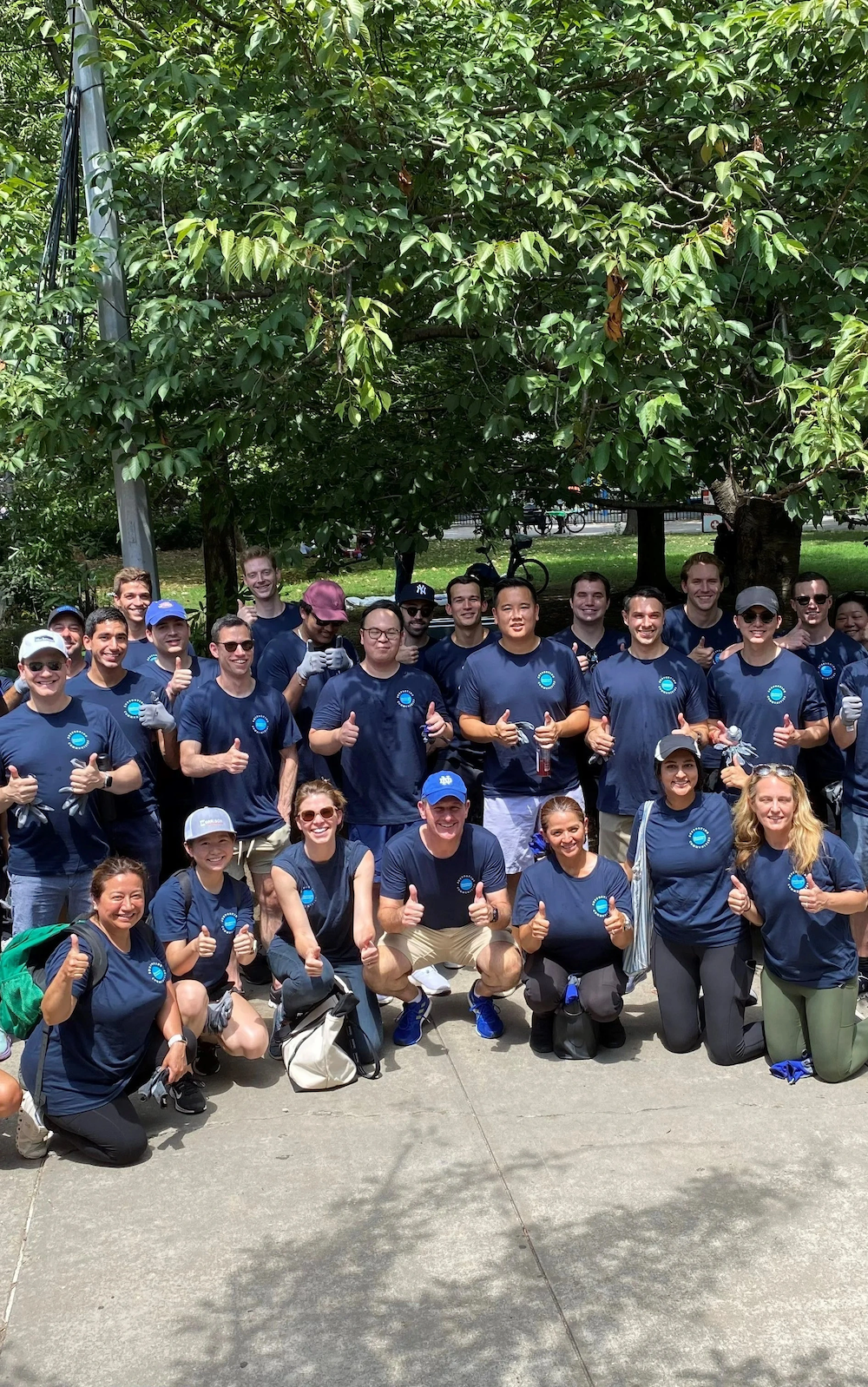 Blackstone employees who volunteer with New York Cares at Marcus Garvey Park in Central Harlem