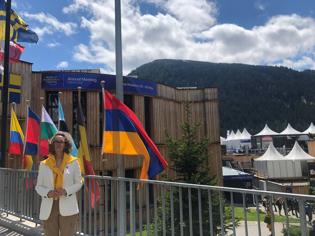 Nicola Acutt with flags outside WEF